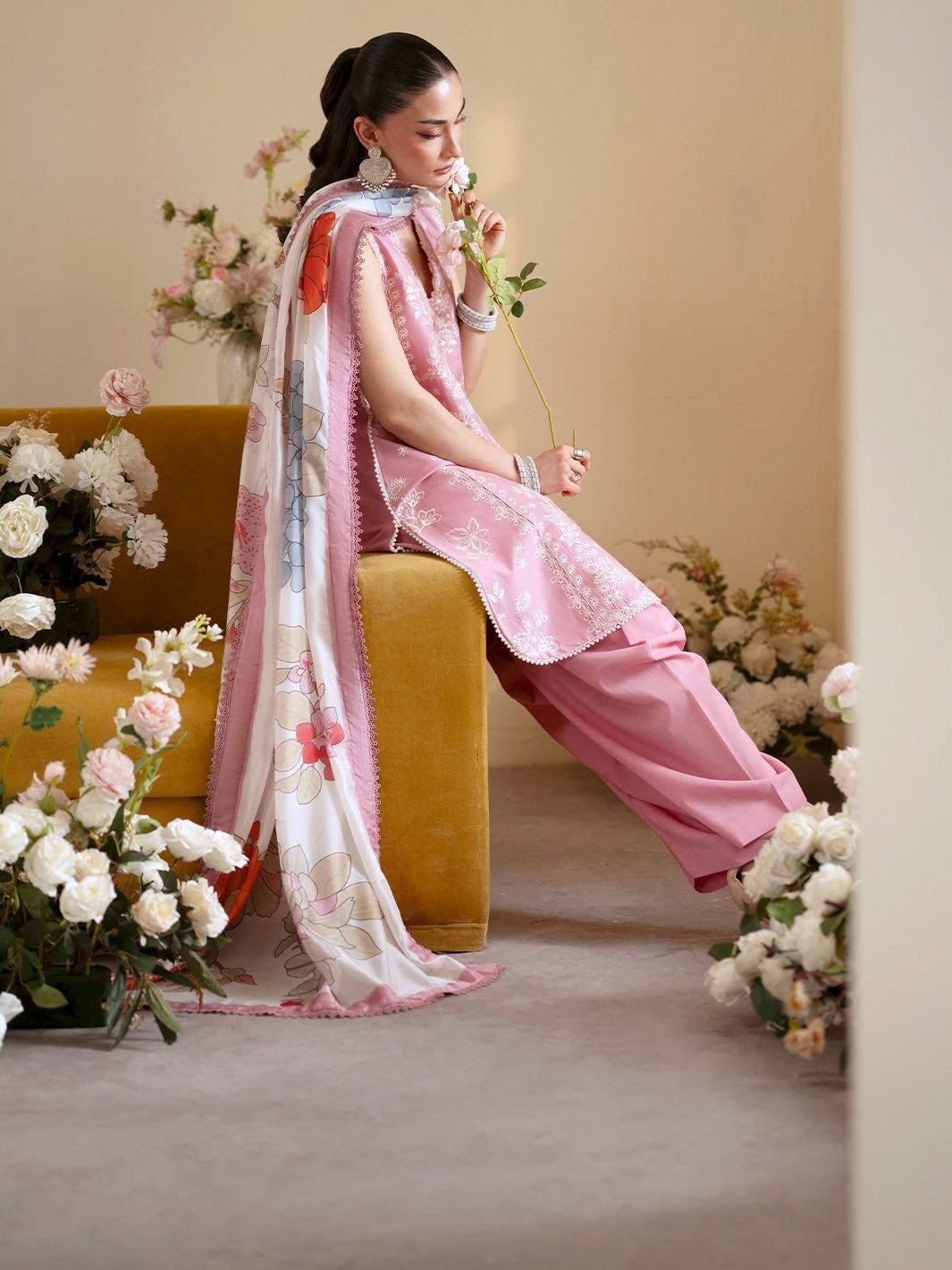 Model wearing a hand-embroidered Oxybliss outfit